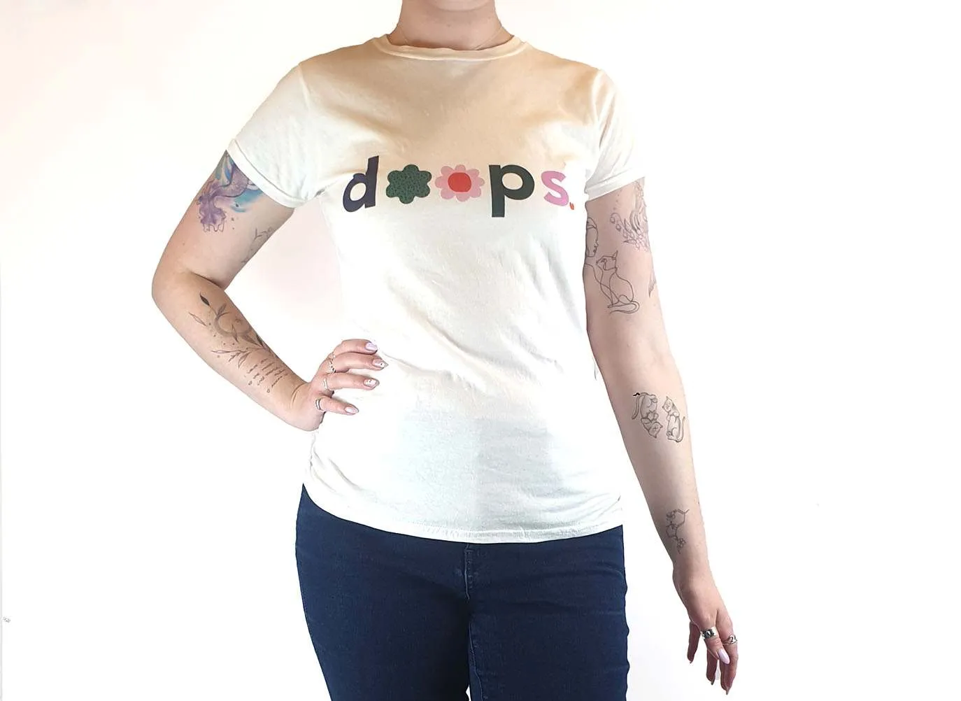 Doops white tee shirt with fun logo size XL (tiny fit, best fits size 12)
