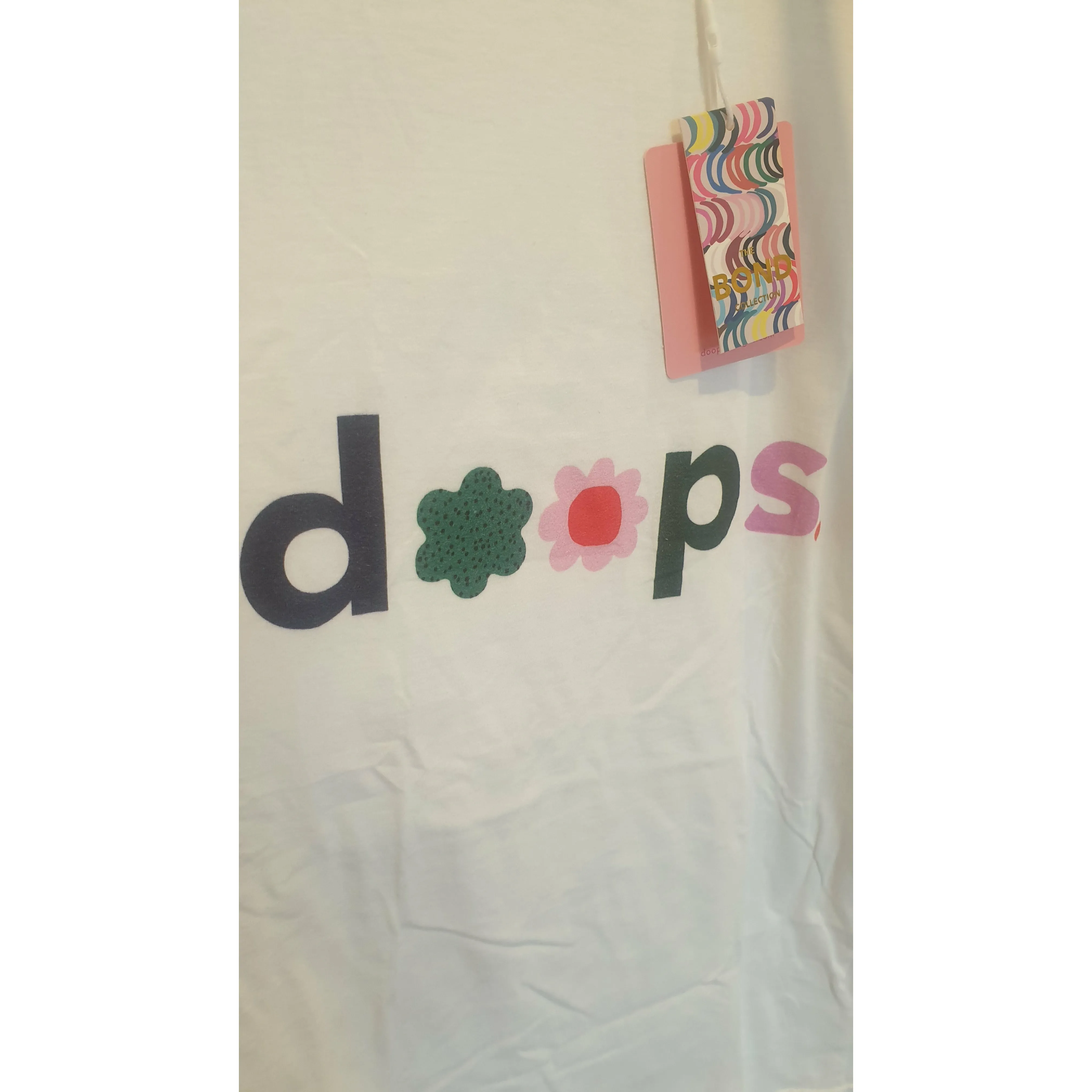 Doops white tee shirt with fun logo size XL (tiny fit, best fits size 12)